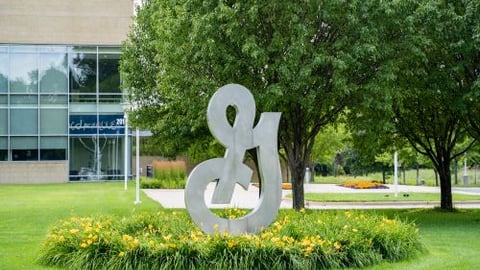 a sign in front of a statue