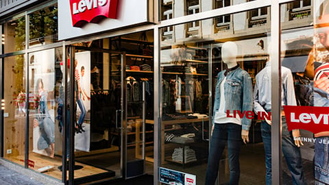 a person standing in front of a store