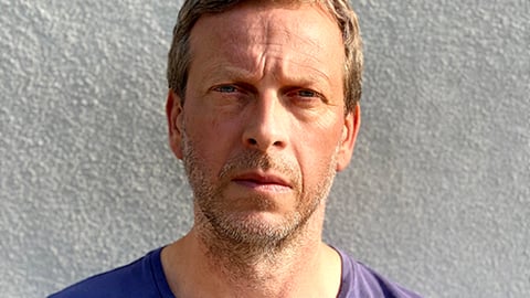 a man wearing a blue shirt