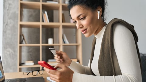 Young woman holding phone