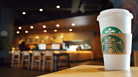 Starbucks coffee cup on table