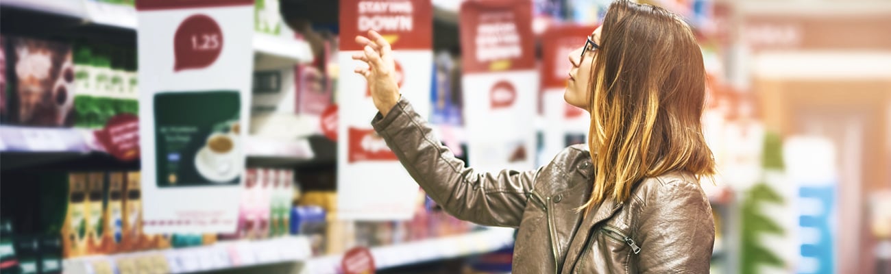 female shopper browsing shelf