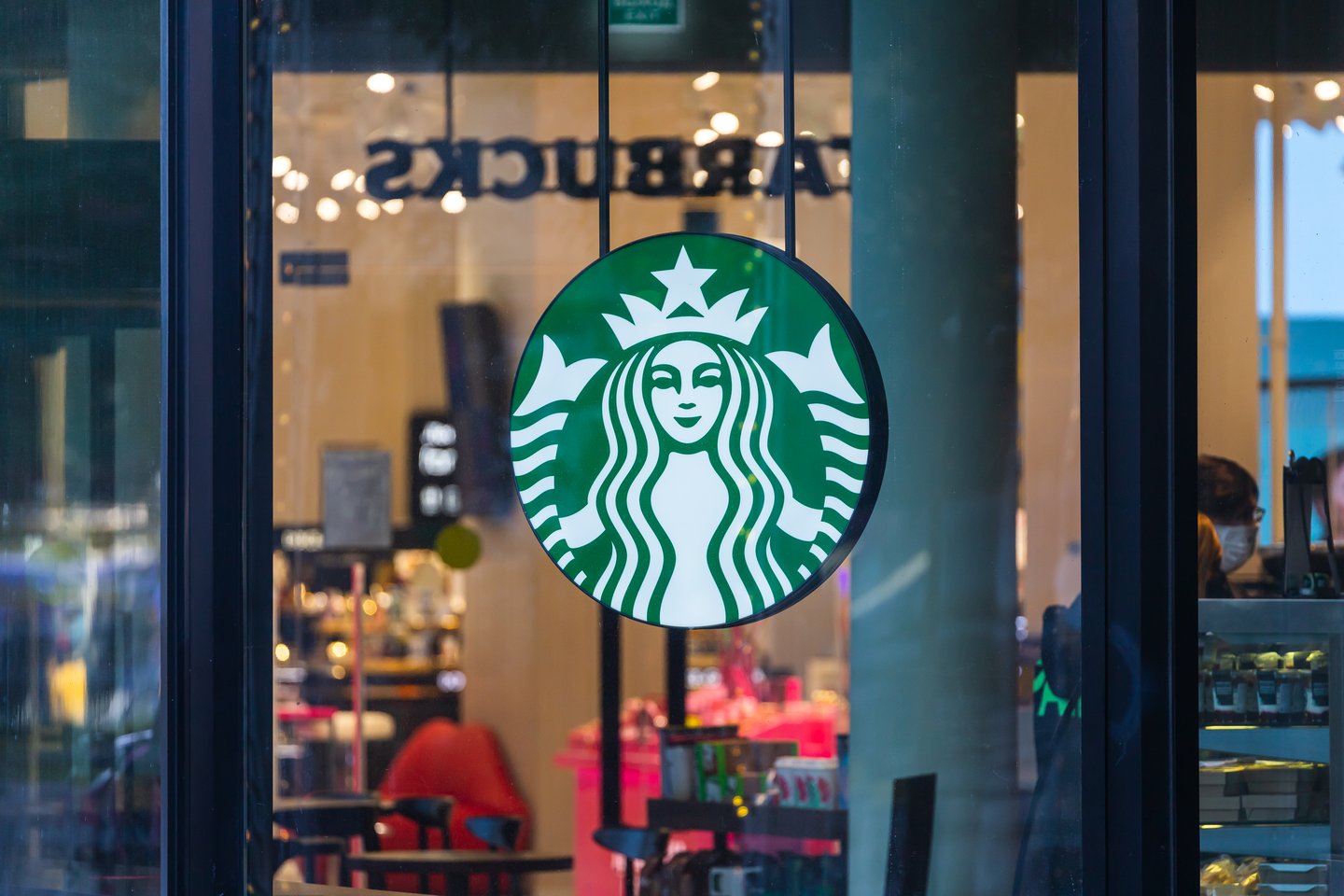 Starbucks logo in front of storefront