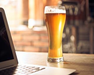 a close up of a laptop computer sitting on top of a wooden table