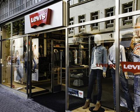 a person standing in front of a store