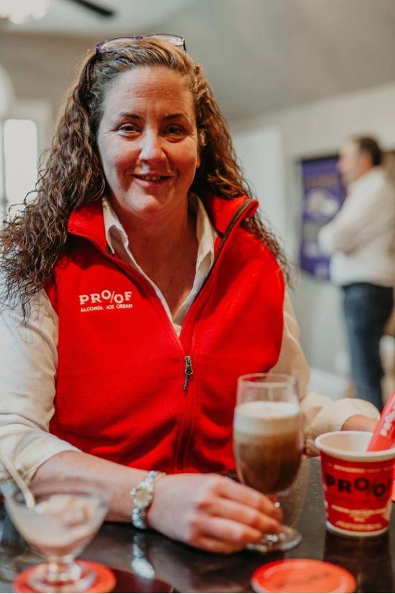 a person sitting at a table with a cup of coffee