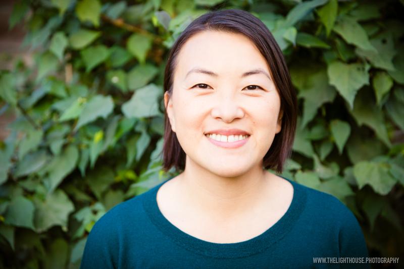 a person in a blue shirt and smiling at the camera