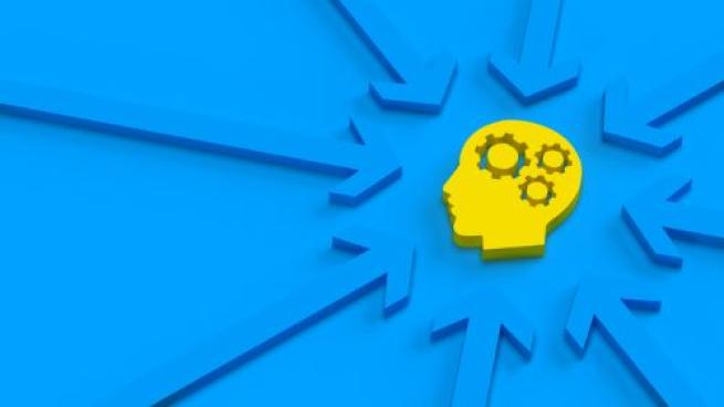 Graphic of consumer intelligence, gears and profile on blue background