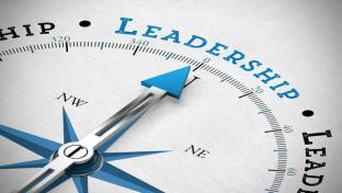 A compass pointing to the word leadership